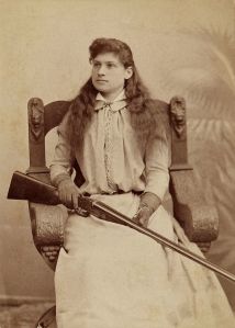 "Annie Oakley c1880" by Baker Art Gallery - Heritage Auction Gallery. Licensed under Public domain via Wikimedia Commons - http://commons.wikimedia.org/wiki/File:Annie_Oakley_c1880.jpg#mediaviewer/File:Annie_Oakley_c1880.jpg