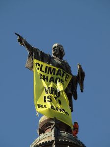 Climate campaign slogan - "Climate Chaos Who is to Blame" on Columbus Monument, Barcelona